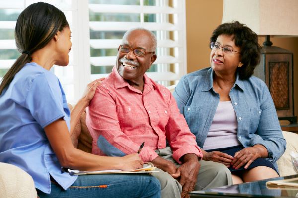 Nurse speaking with a husband and wife